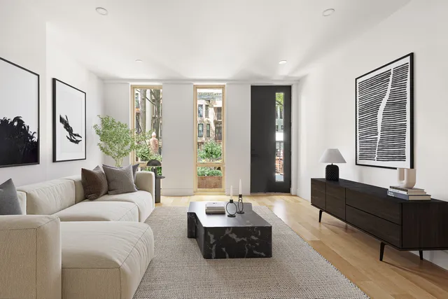 a living room with furniture and windows