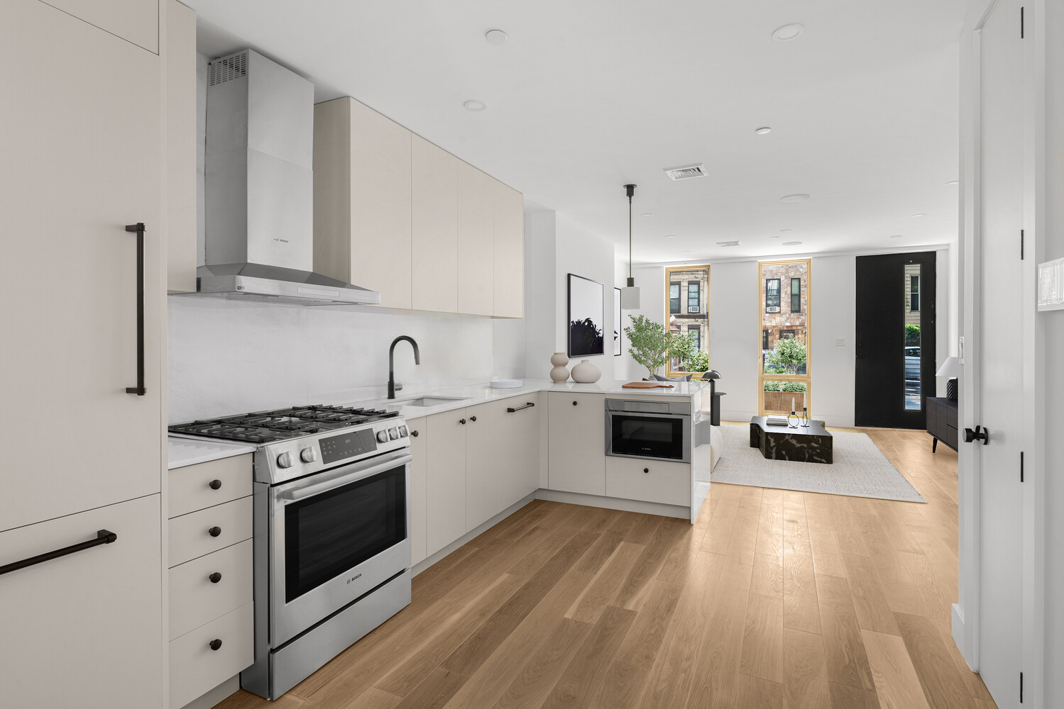 696 Chauncey Street, Unit 1R Brooklyn, NY 11207 - Photo 3 of 13 a kitchen with a stove a sink and a refrigerator