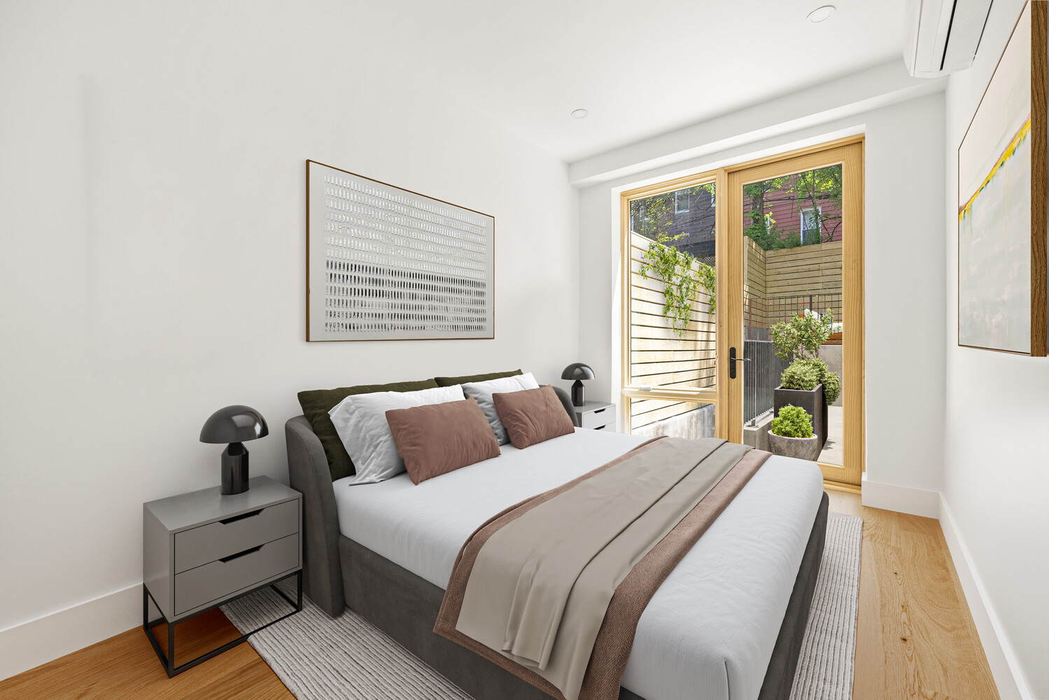 696 Chauncey Street, Unit 1R Brooklyn, NY 11207 - Photo 7 of 13 a bedroom with a bed and wooden floor