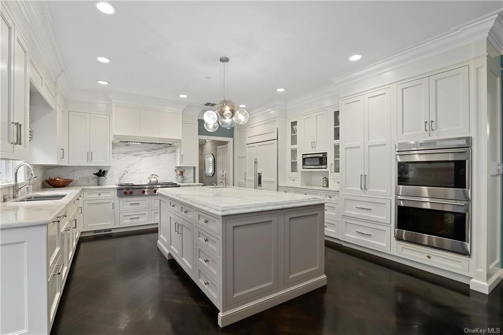 a kitchen with stainless steel appliances granite countertop a stove oven and a sink