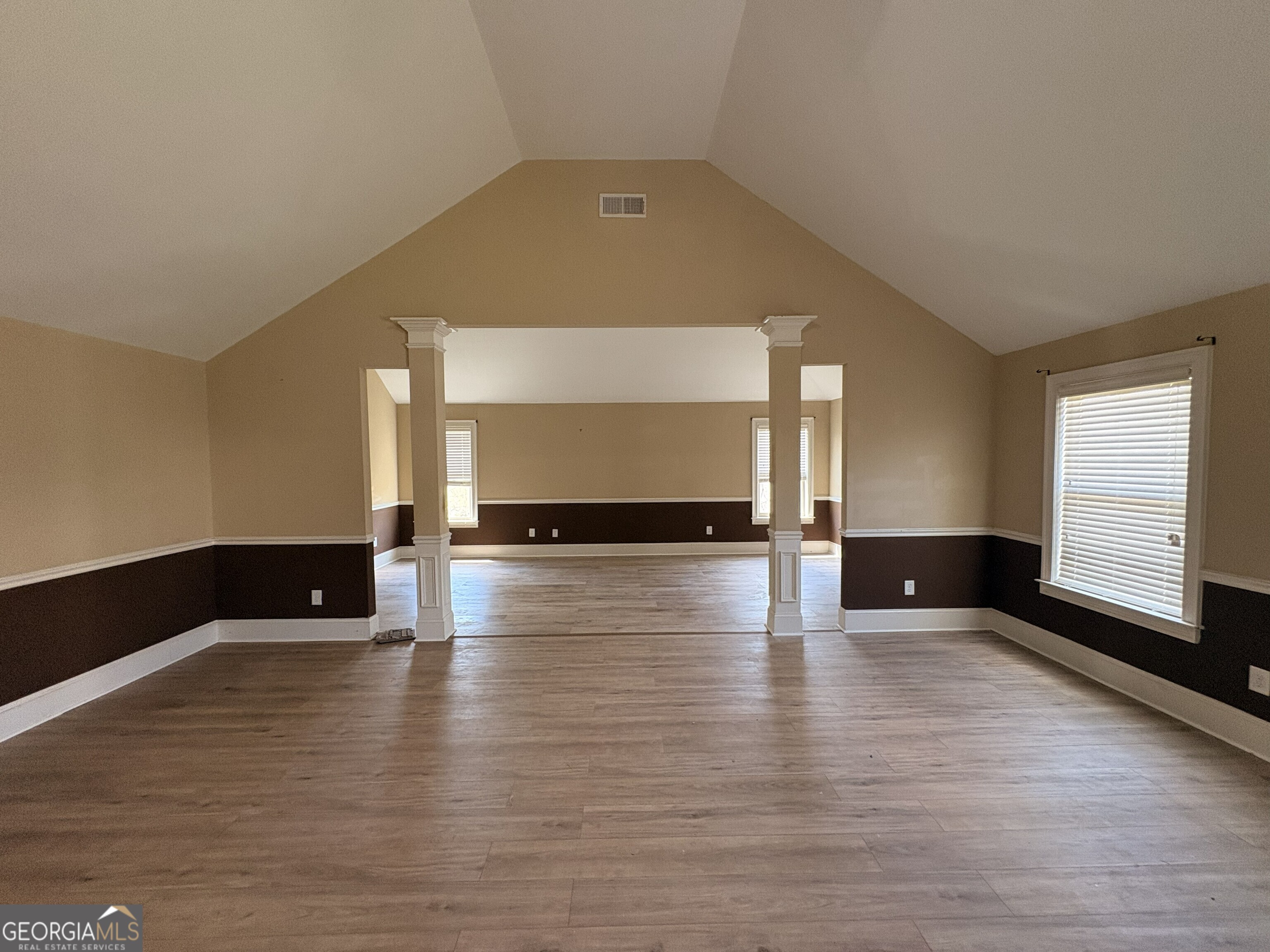410 Ripsaw Court Grovetown, GA 30813 - Photo 15 of 64 a view of an empty room with wooden floor and a window