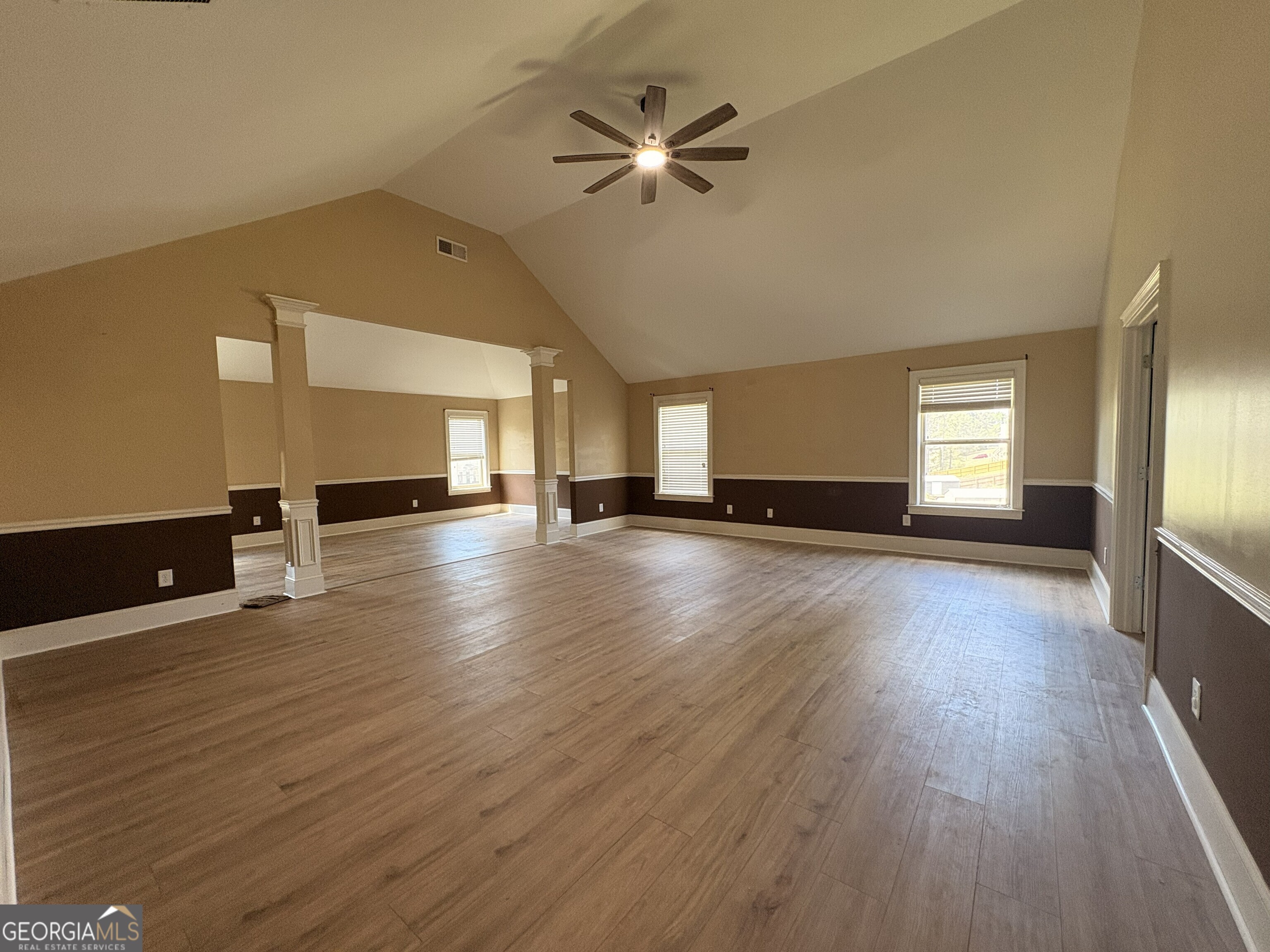 410 Ripsaw Court Grovetown, GA 30813 - Photo 21 of 64 a view of an empty room with a window and wooden floor