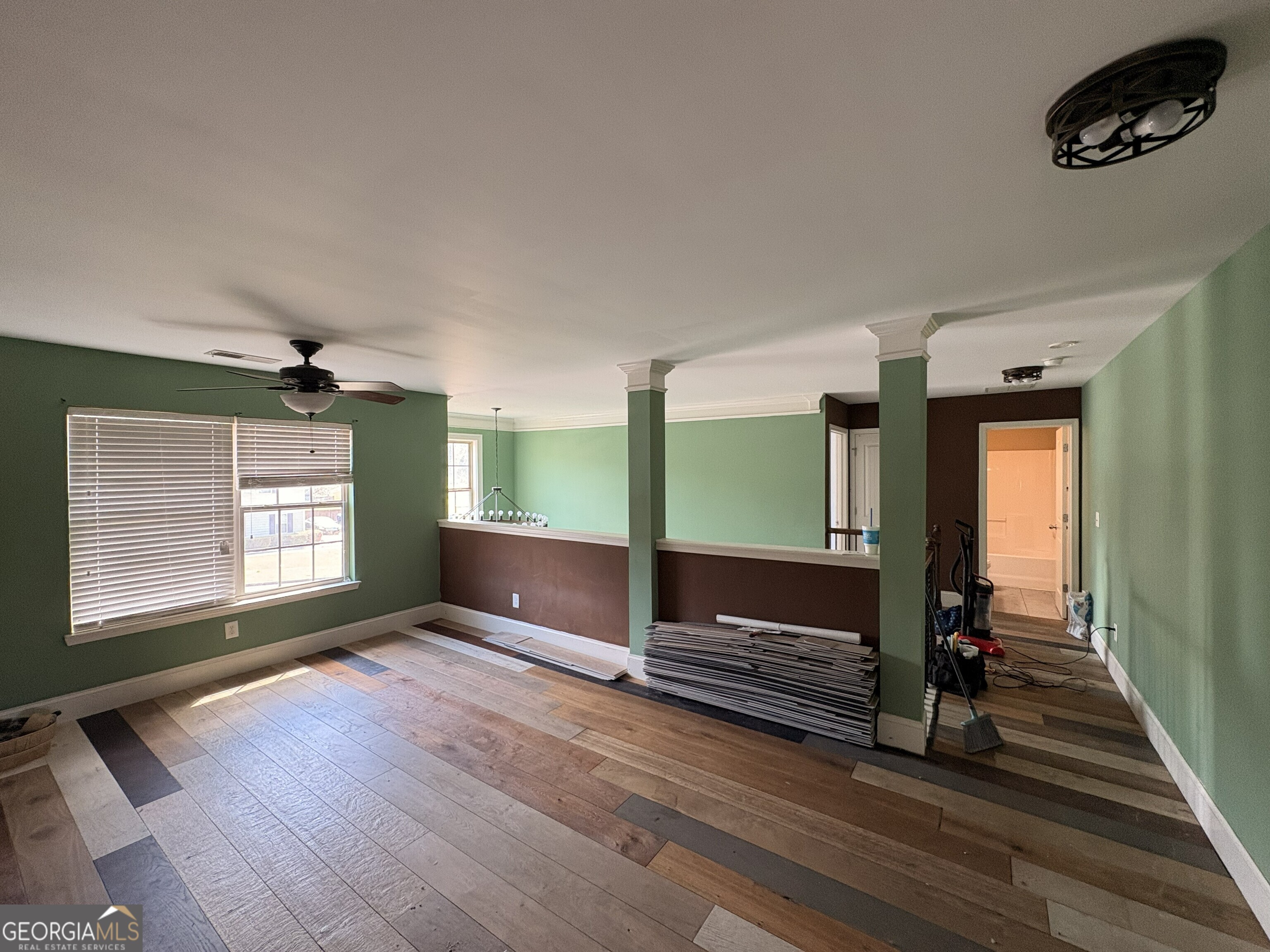 410 Ripsaw Court Grovetown, GA 30813 - Photo 45 of 64 a view of an empty room with wooden floor and windows