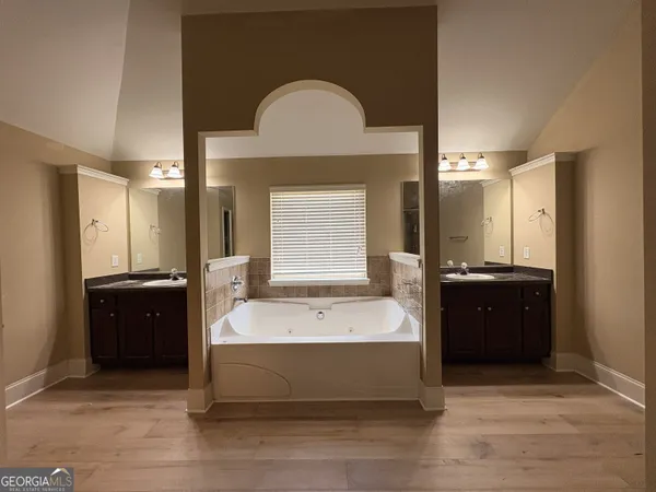 a bedroom with a bed and furniture