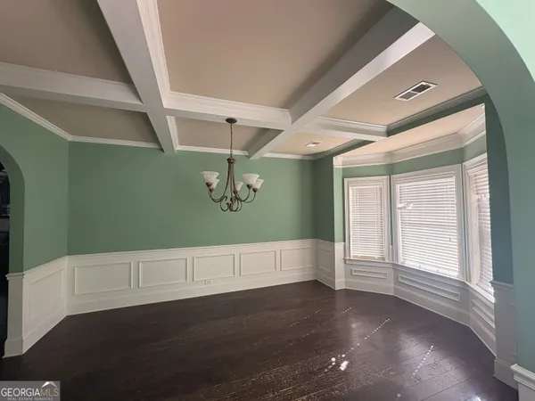 a bathroom with a glass shower door a bathtub a sink and a mirror