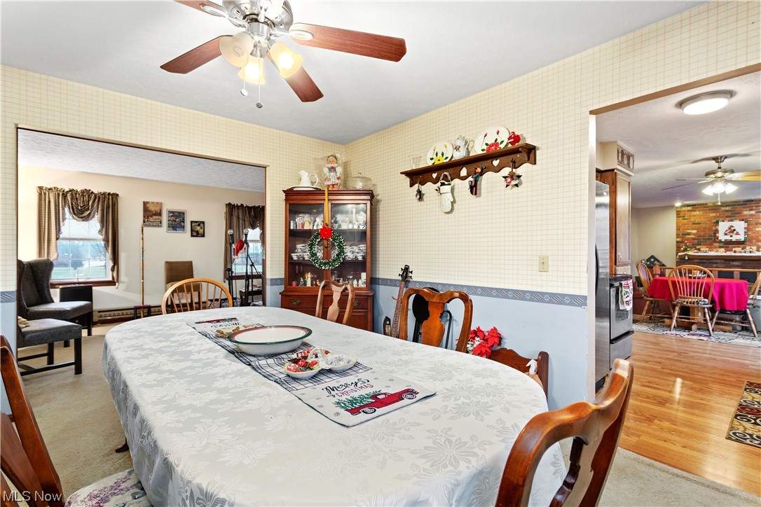 3465 Yost Road Litchfield, OH 44253 - Photo 9 of 27 Carpeted dining space featuring ceiling fan