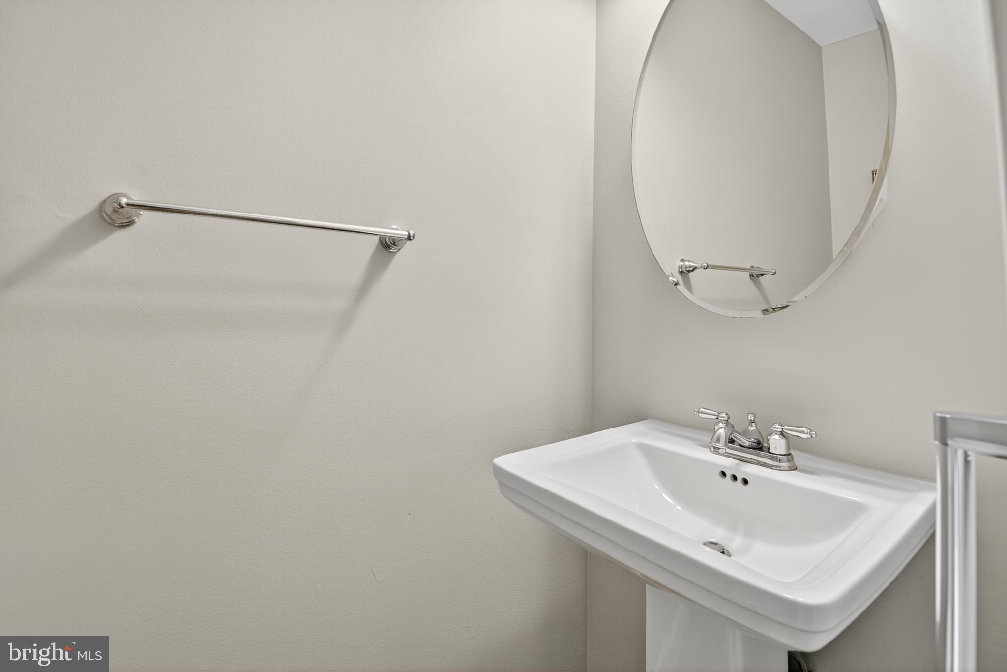 5 Turnham Court Gaithersburg, MD 20878 - Photo 13 of 56 a bathroom with a sink and a mirror