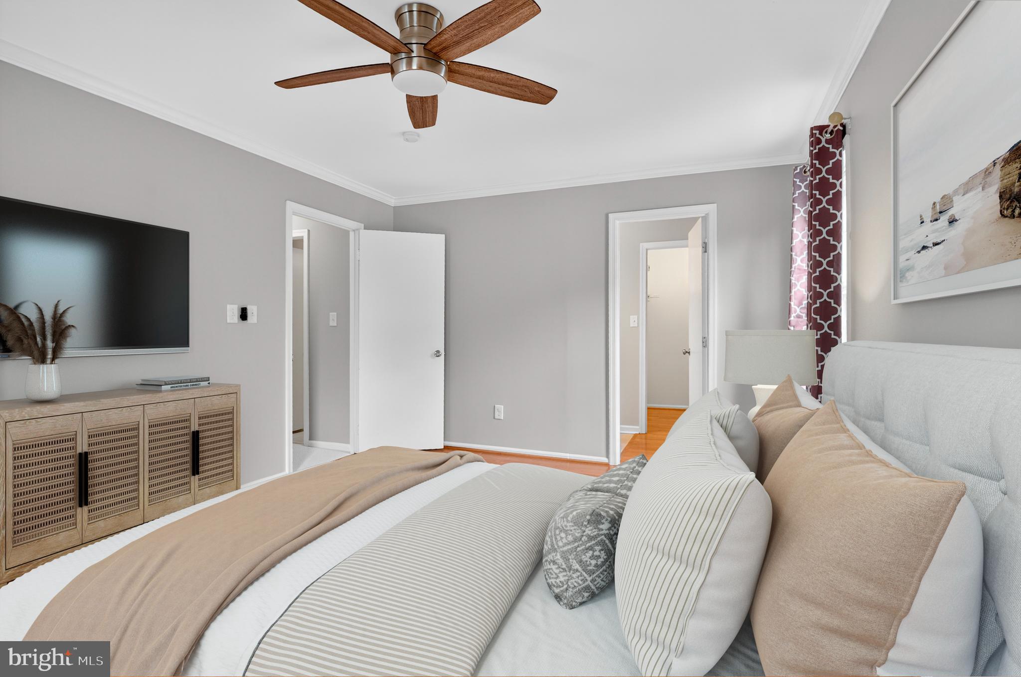 5 Turnham Court Gaithersburg, MD 20878 - Photo 17 of 56 a bedroom with a bed and a flat screen tv