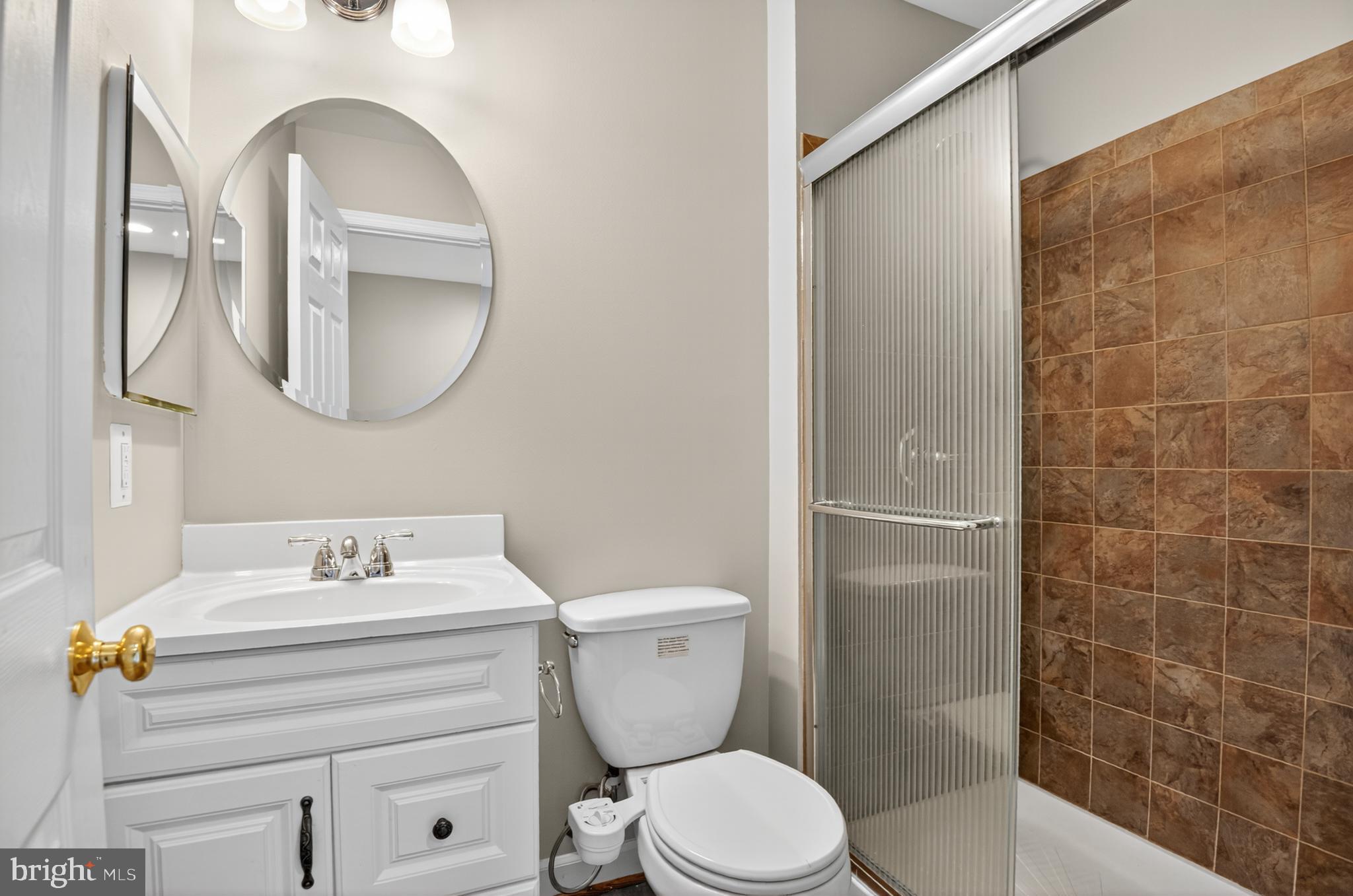 5 Turnham Court Gaithersburg, MD 20878 - Photo 33 of 56 a bathroom with a sink toilet and shower