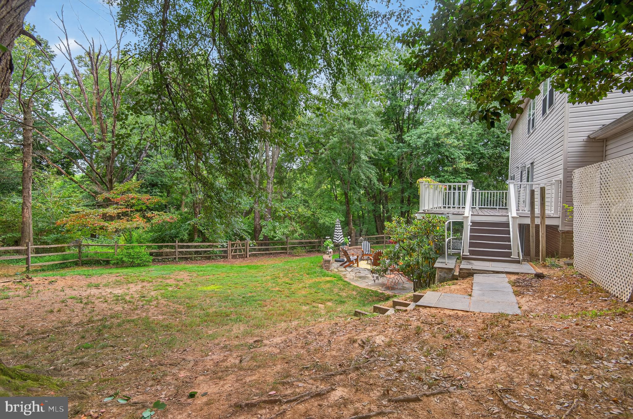 5 Turnham Court Gaithersburg, MD 20878 - Photo 35 of 56 a view of a backyard with table and chairs and potted plants