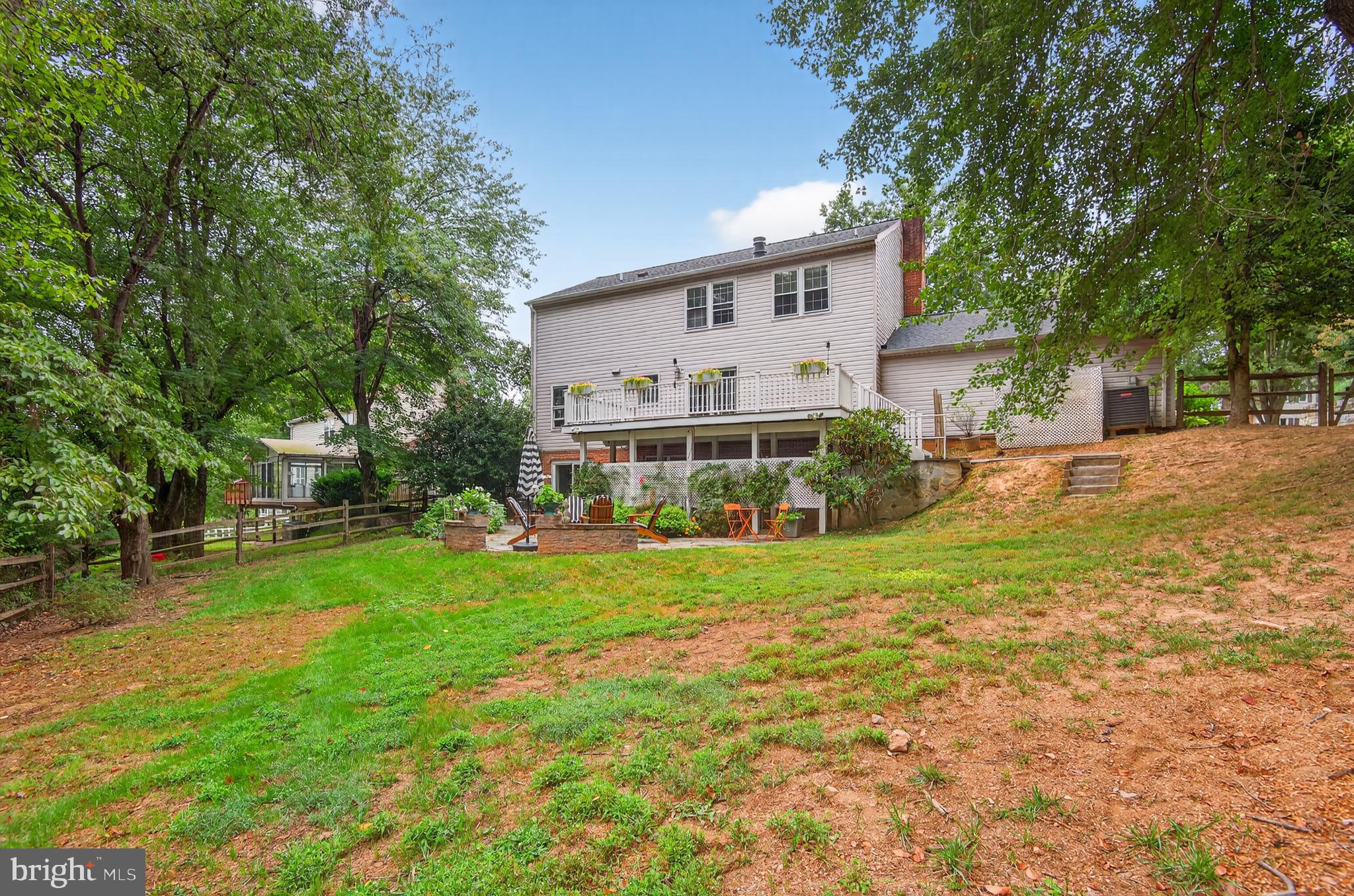 5 Turnham Court Gaithersburg, MD 20878 - Photo 39 of 56 a front view of a house with a yard and trees