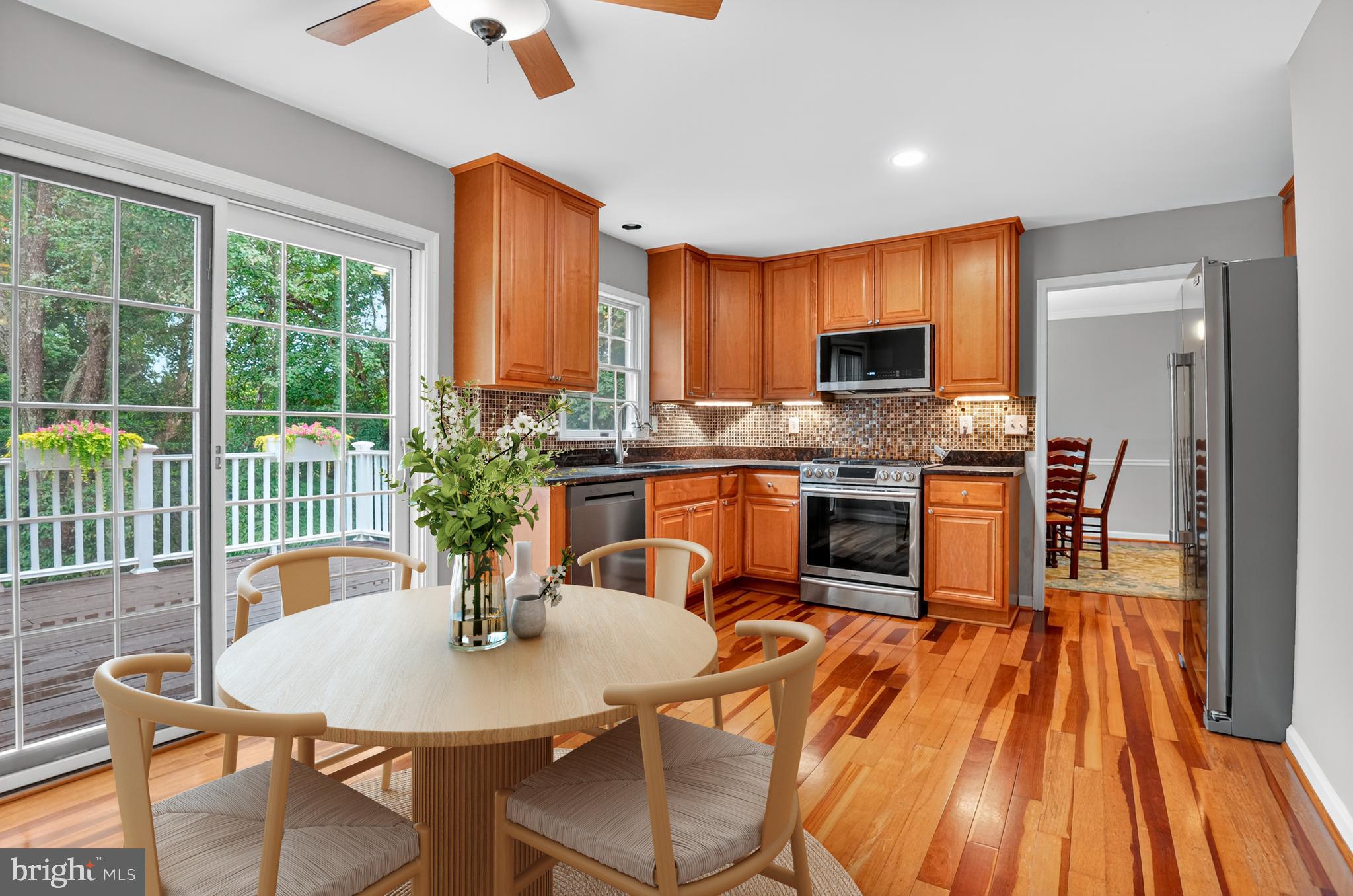 5 Turnham Court Gaithersburg, MD 20878 - Photo 6 of 56 a kitchen with a table chairs stove and refrigerator
