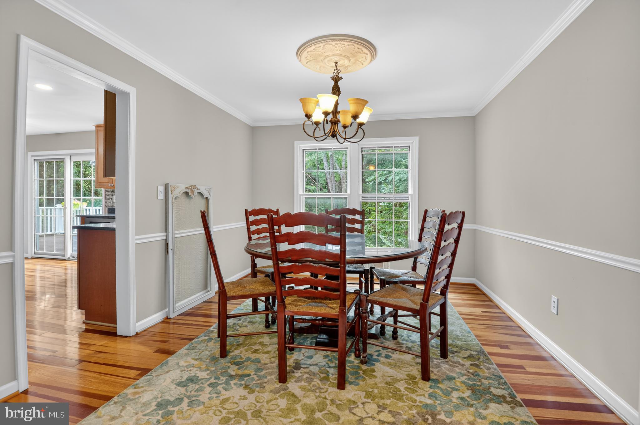 5 Turnham Court Gaithersburg, MD 20878 - Photo 10 of 56 a view of a dining room with furniture a chandelier and wooden floor