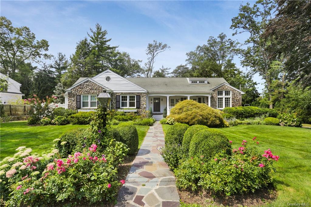 Welcome home to this impeccably maintained cape style home on beautifully landscaped property one of most sought after blocks in Edgemont