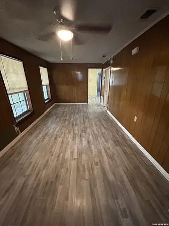 a view of livingroom with window and wooden floor