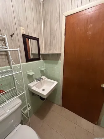 a bathroom with a sink toilet and vanity