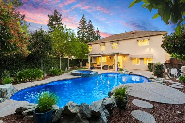 a view of a swimming pool with a patio