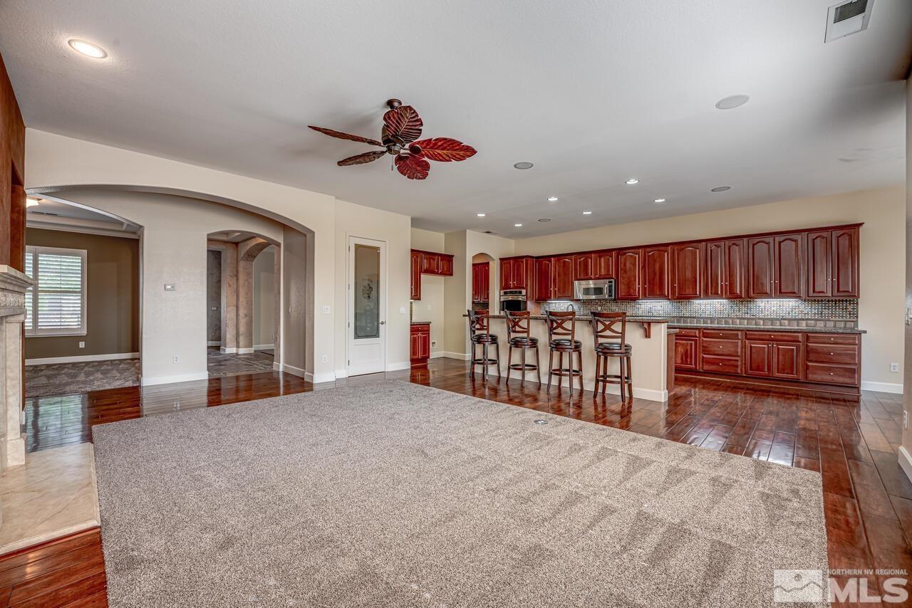 2725 Bull Rider Drive Reno, NV 89521 - Photo 11 of 40 a living room with furniture and a large window