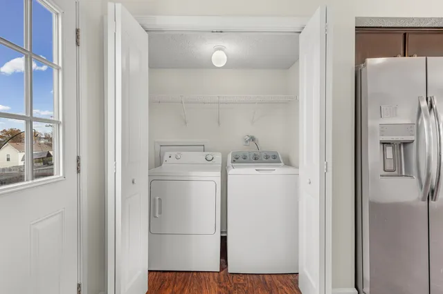a view of storage and utility room with washer and dryer