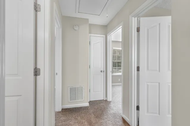 a view of a hallway with closet area