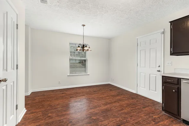 a view of a kitchen with a sink and a window