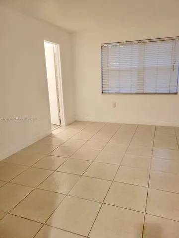 a view of a room that has a sink and a window