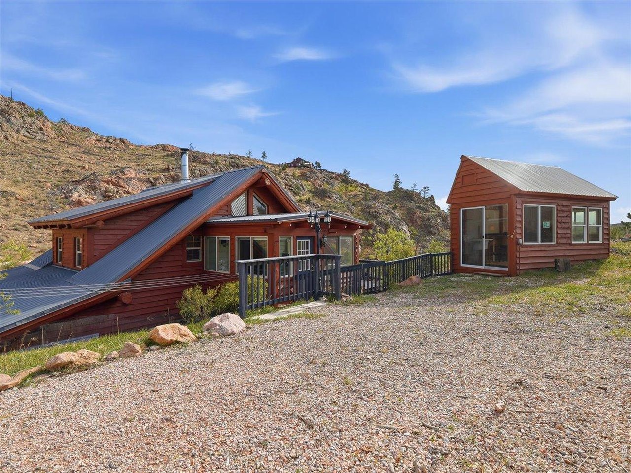 1652 Eiger Road Livermore, CO 80536 - Photo 14 of 50 Enter at the Sunroom w/surrounding Deck Space