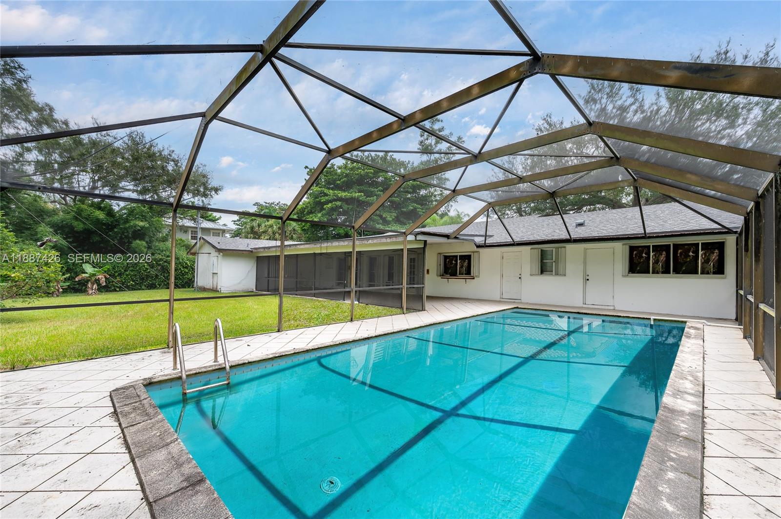 7485 Southwest 122nd Street Pinecrest, FL 33156 - Photo 11 of 12 a view of a backyard