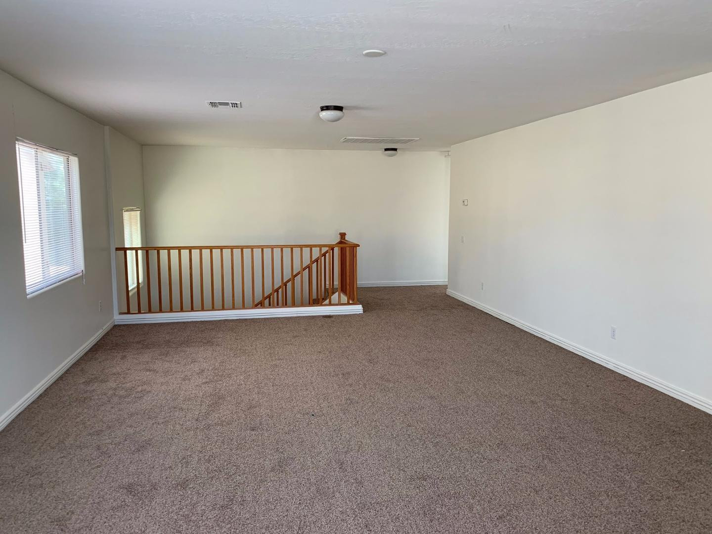 43589 West Cowpath Road Maricopa, AZ 85138 - Photo 5 of 6 a view of an empty room with a window