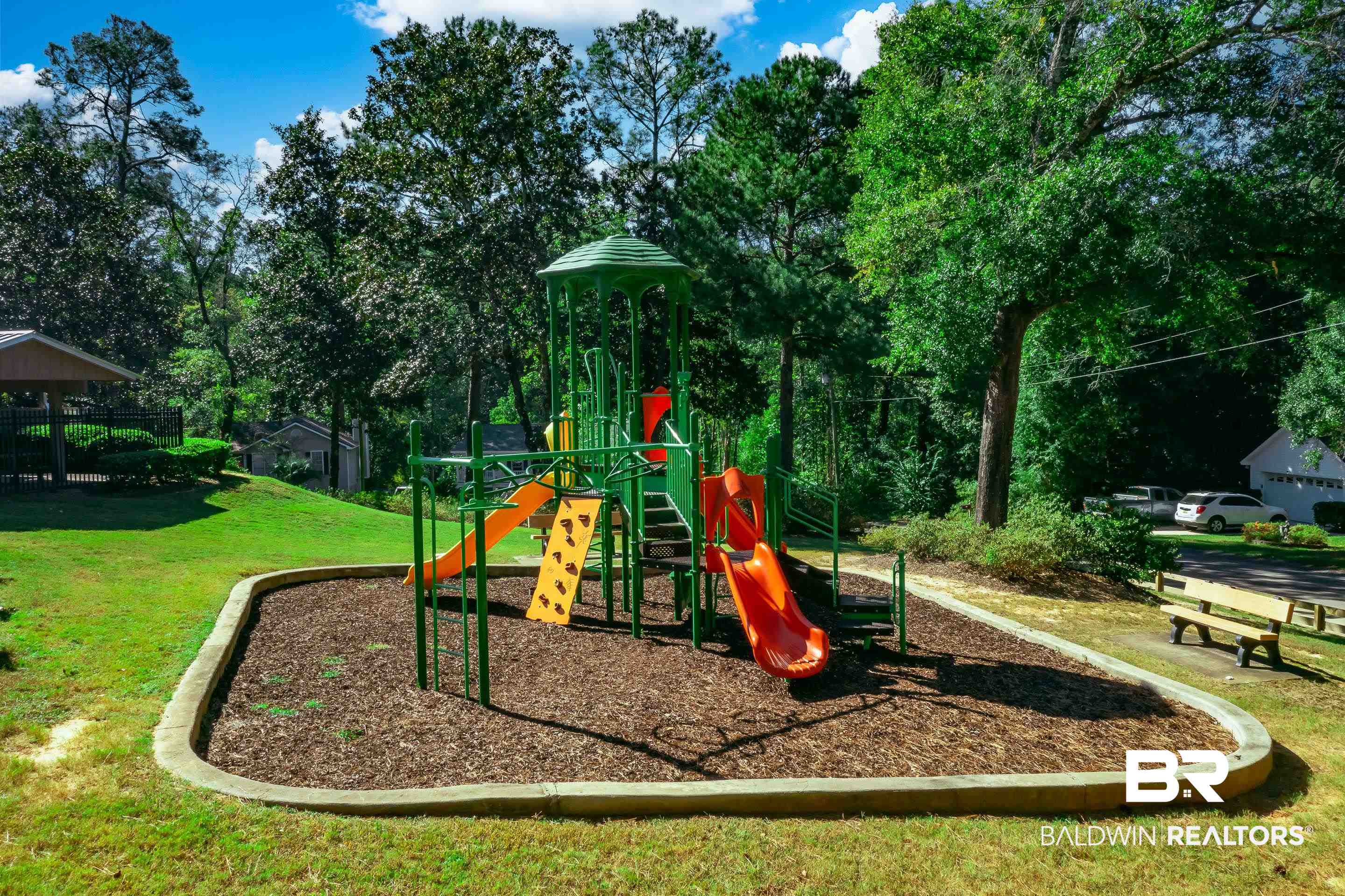 209 Montclair Loop Daphne, AL 36526 - Photo 9 of 55 Community playground with a yard and view of wooded area