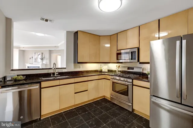 a view of a kitchen from the hallway