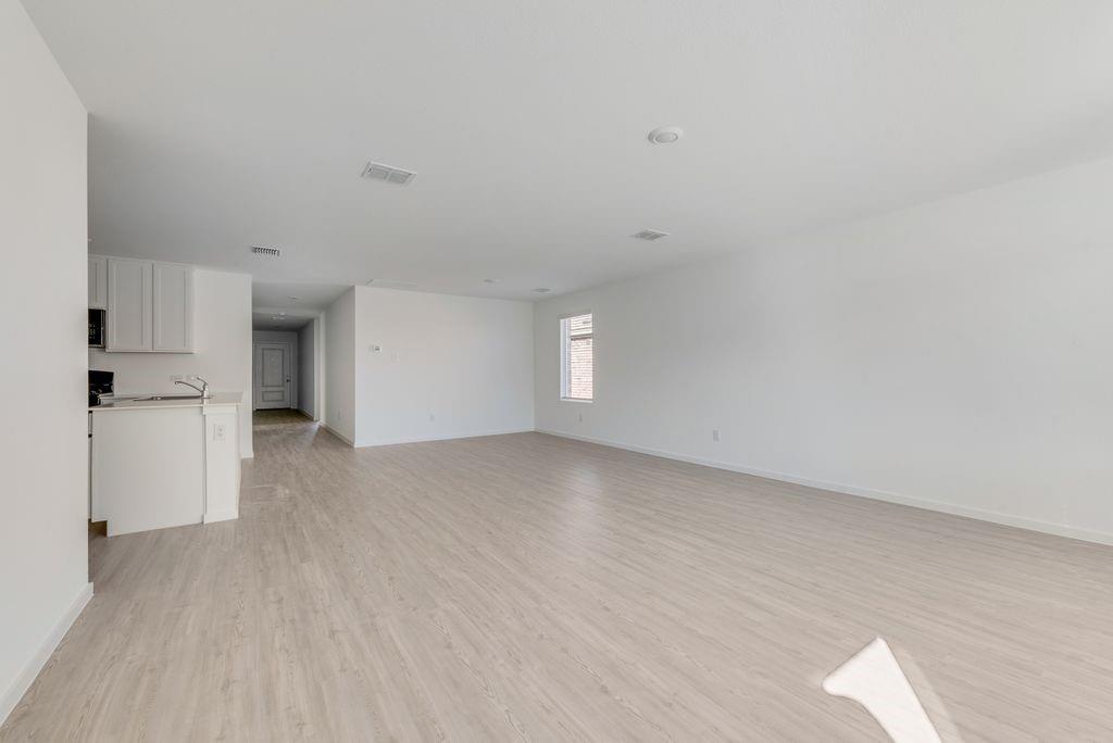 4048 Twinleaf Drive Crowley, TX 76036 - Photo 9 of 24 a view of empty room with wooden floor