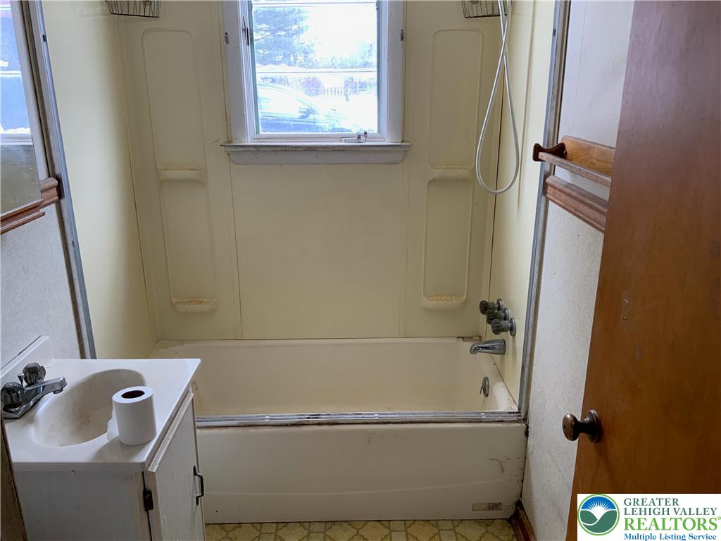 580 Gilbert Road Gilbert, PA 18331 - Photo 11 of 11 a bathroom with a bathtub and a window
