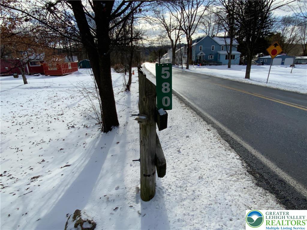 580 Gilbert Road Gilbert, PA 18331 - Photo 2 of 11 a street view covered with snow