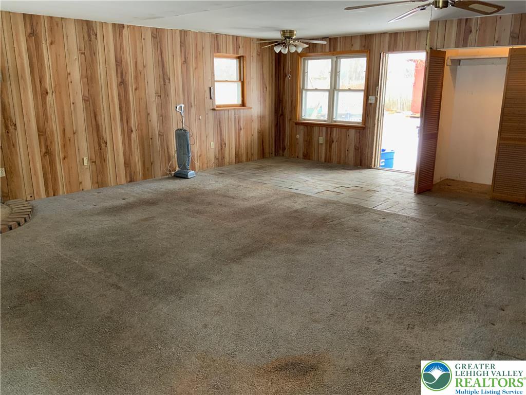 580 Gilbert Road Gilbert, PA 18331 - Photo 5 of 11 an empty room with windows