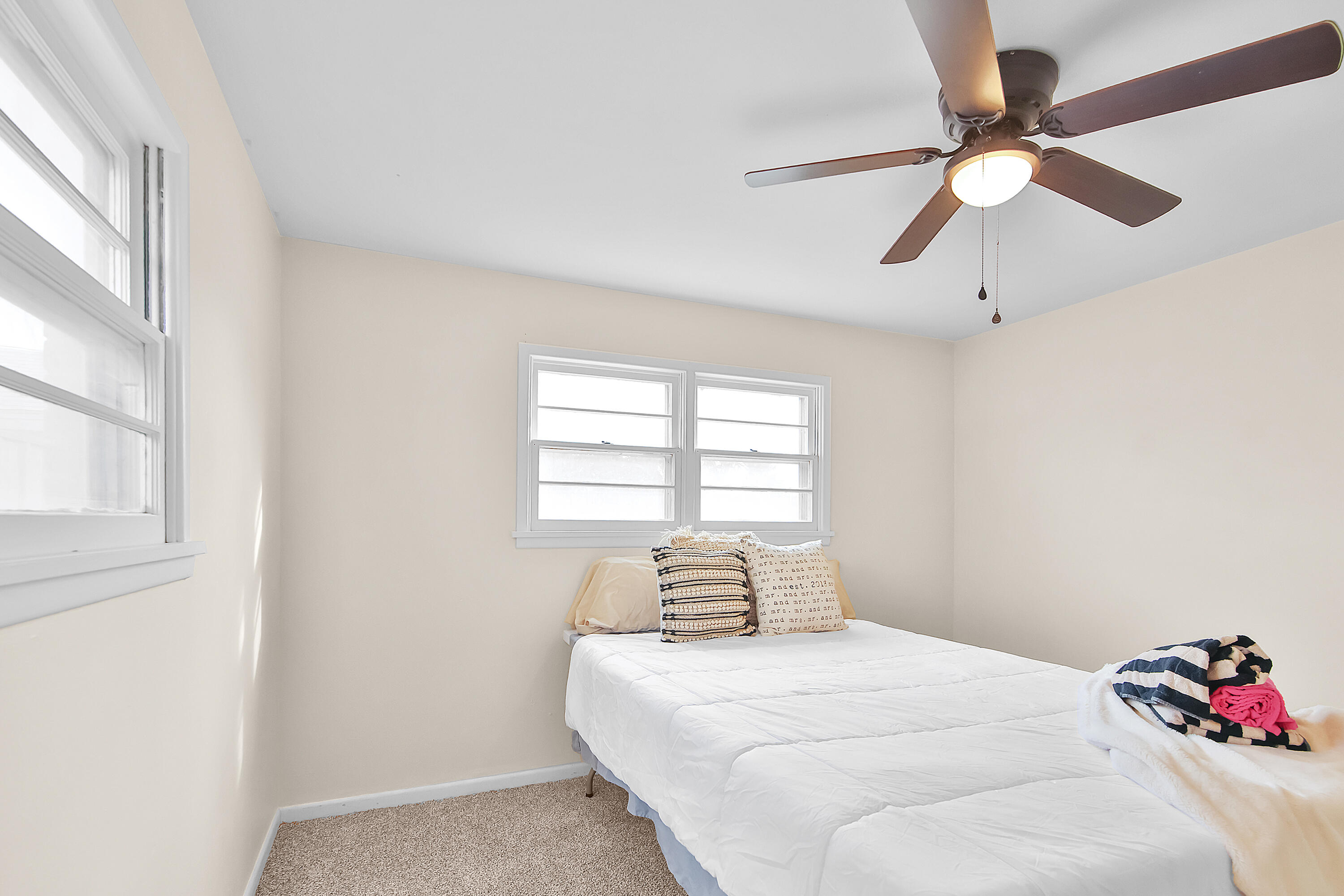 4513 48th Street Lubbock, TX 79414 - Photo 13 of 55 a bedroom with a bed and a window