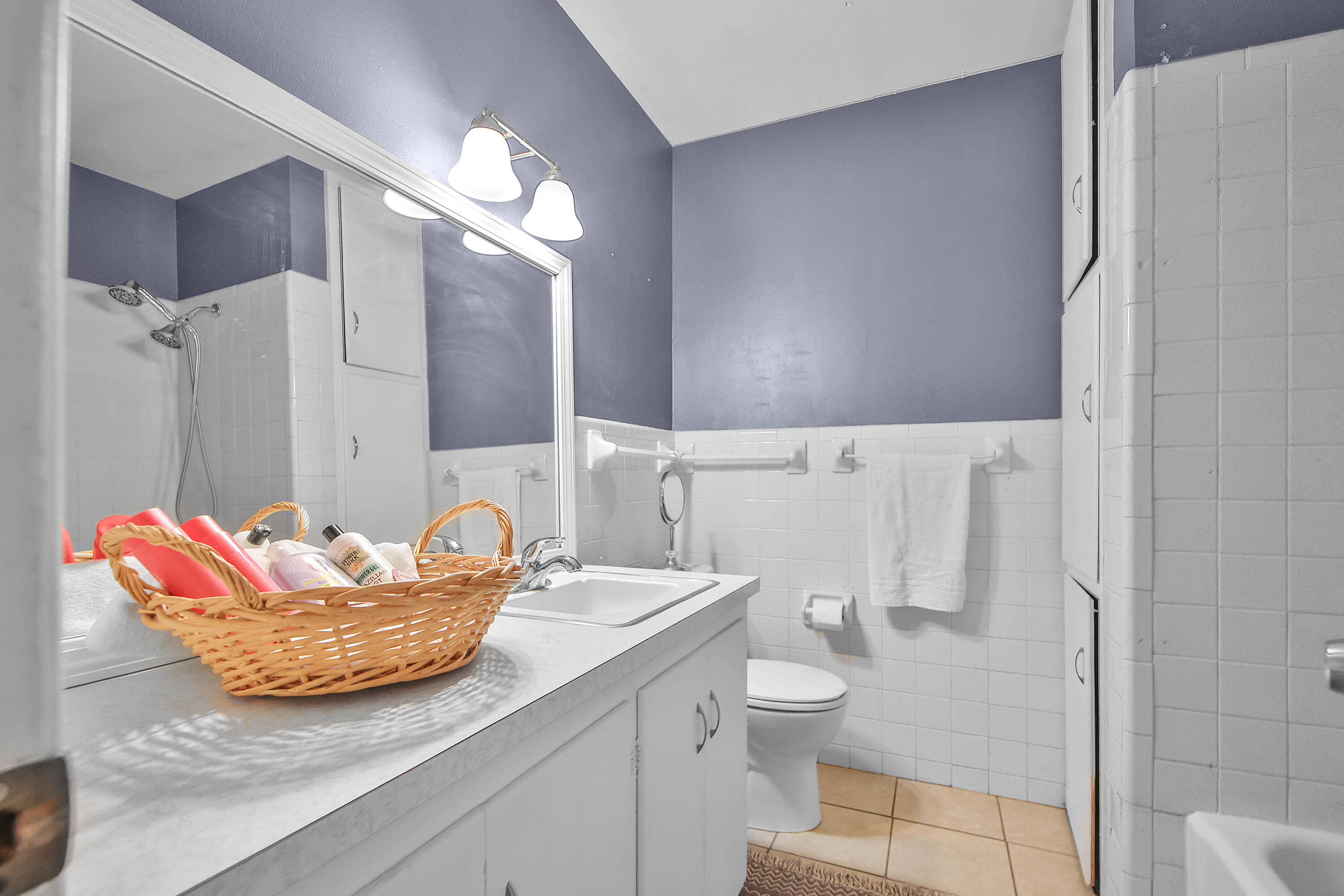 4513 48th Street Lubbock, TX 79414 - Photo 34 of 55 a bathroom with a granite countertop sink and a mirror