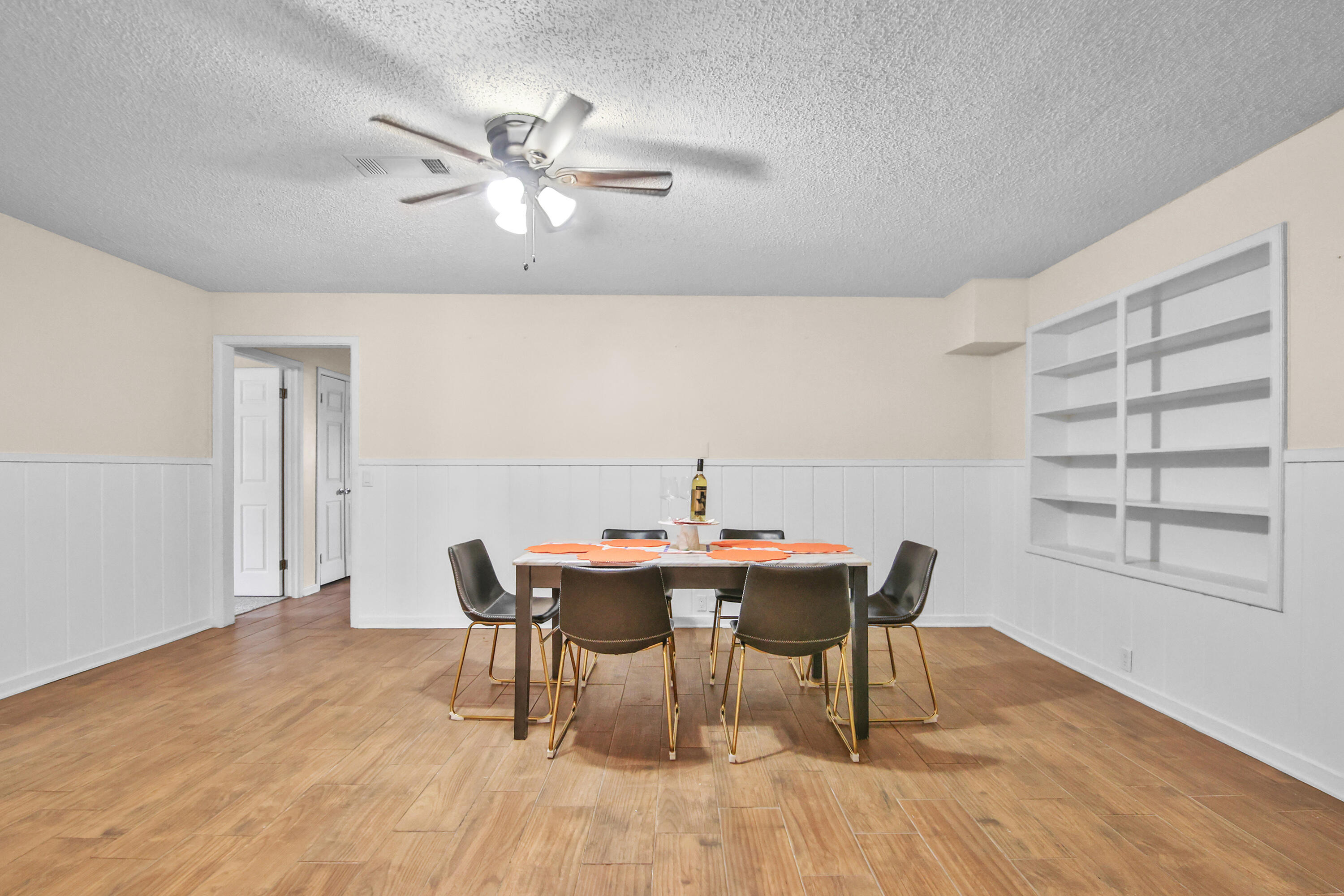 4513 48th Street Lubbock, TX 79414 - Photo 41 of 55 a view of a dining room with furniture and wooden floor