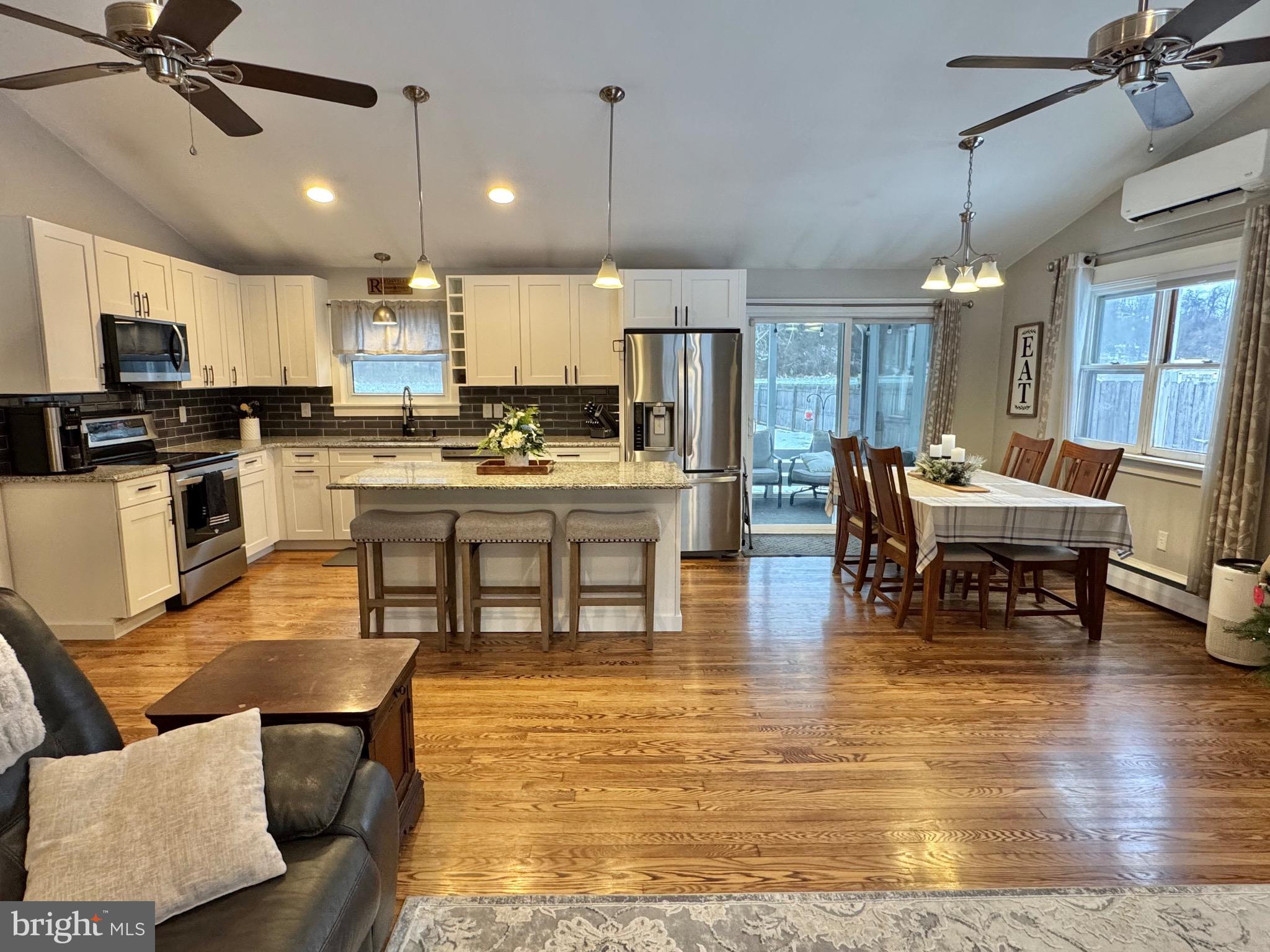 699 Honey Creek Road Reedsville, PA 17084 - Photo 4 of 26 a living room with stainless steel appliances kitchen island granite countertop furniture and a view of kitchen
