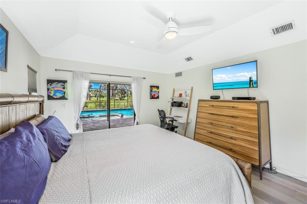2016 Duke Drive Naples, FL 34110 - Photo 12 of 23 a bed room with a bed and a window