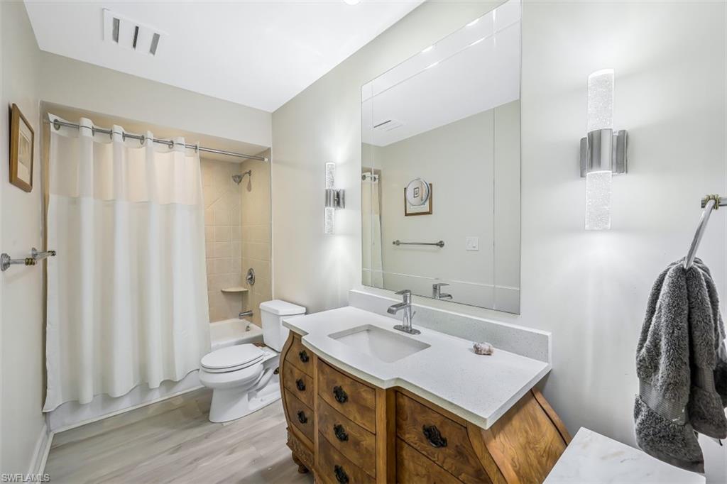 2016 Duke Drive Naples, FL 34110 - Photo 16 of 23 a bathroom with a sink toilet and shower