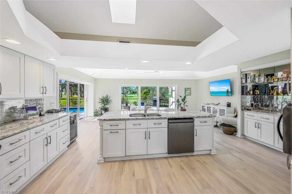 2016 Duke Drive Naples, FL 34110 - Photo 5 of 23 a kitchen with white cabinets appliances and a window
