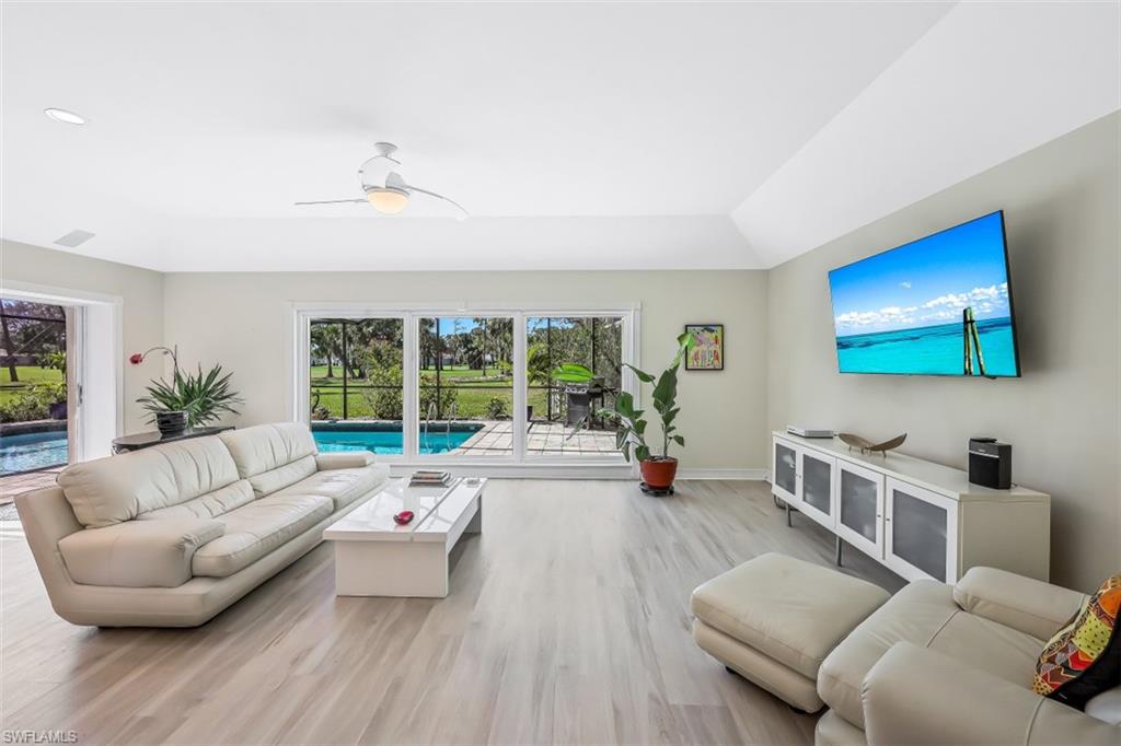 2016 Duke Drive Naples, FL 34110 - Photo 8 of 23 a living room with furniture and a flat screen tv