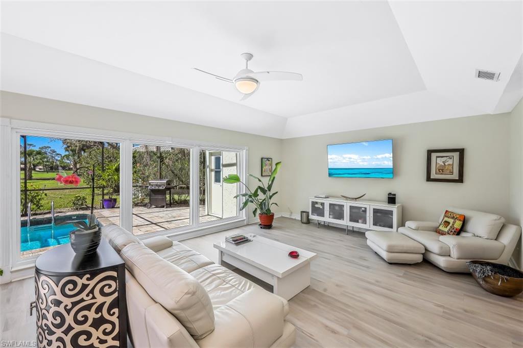 2016 Duke Drive Naples, FL 34110 - Photo 9 of 23 a living room with furniture and a flat screen tv