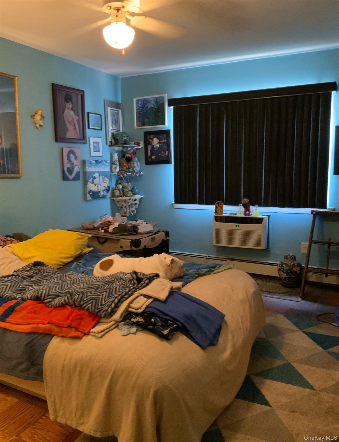 2261 Palmer Avenue, Unit 2A New Rochelle, NY 10801 - Photo 8 of 12 Bedroom featuring a wall mounted AC and a ceiling fan