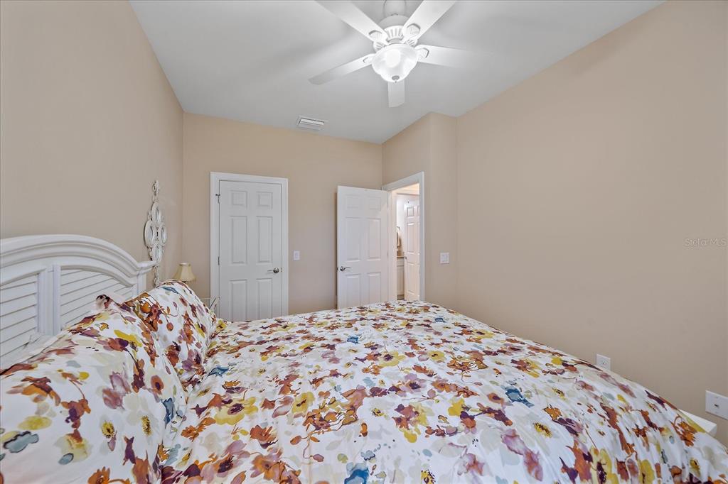 17535 Hampton Falls Terrace Bradenton, FL 34202 - Photo 14 of 41 a bedroom with a large bed