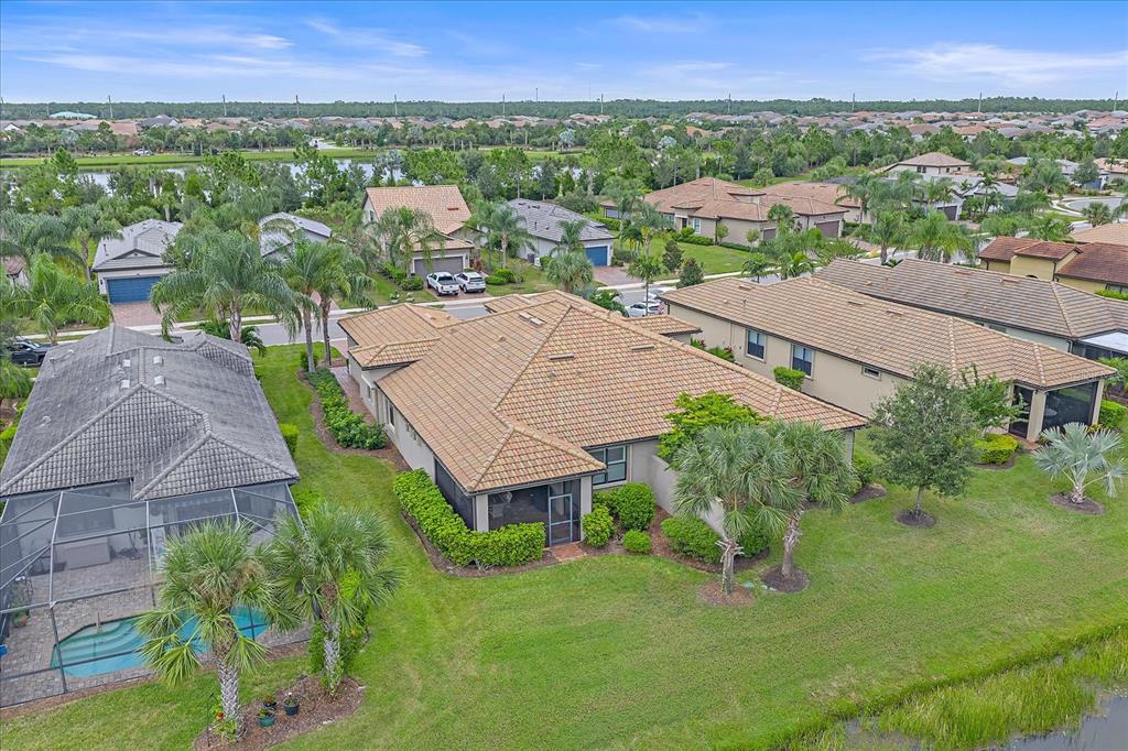17535 Hampton Falls Terrace Bradenton, FL 34202 - Photo 39 of 41 an aerial view of a house with yard and green space