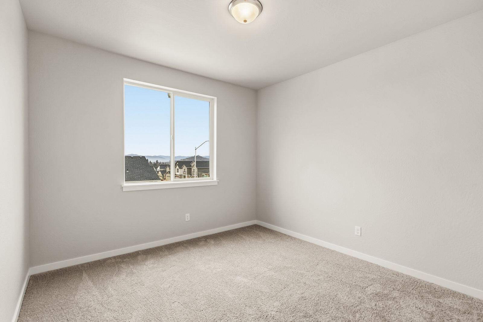 669 Old Waverly Way, Unit 20 Eagle Point, OR 97524 - Photo 22 of 32 an empty room with a window