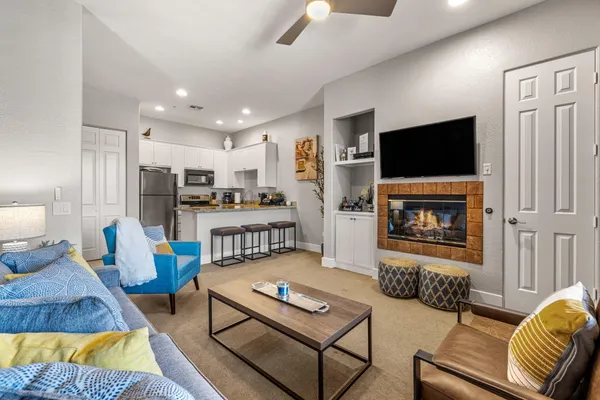 a living room with furniture and a fireplace