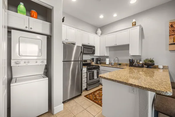 a kitchen with a refrigerator sink and microwave